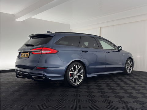 Ford Mondeo Wagon 2.0 IVCT HEV ST-Line (INCL.BTW) *LEATHER-MICROFIBRE | ADAPTIVE-CRUISE | FULL-LED | MEMORY-PACK | BLIND-SPOT | HEATED-COMFORTSEATS | CAMERA | KEYLESS | DAB+ | NAVI-FULLMAP | 18''ALU | TOWBAR*