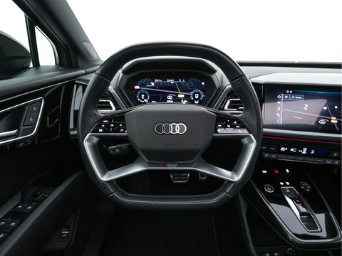 Audi Q4 e-tron 40 Launch edition S Competition 77 kWh [ 3-Fase ] {SOH-90%} (INCL.BTW) *HEAT-PUMP | PANO | HEAD-UP | LEATHER-FABRIC | MATRIX-LED | SONOS-SOUND | ADAPTIVE-CRUISE | HEATED-SPORTSEATS | AMBIENT-LIGHT | DIGI-COCKPIT | CAMERA | KEYLESS | DAB+ | NAVI-FULLMA