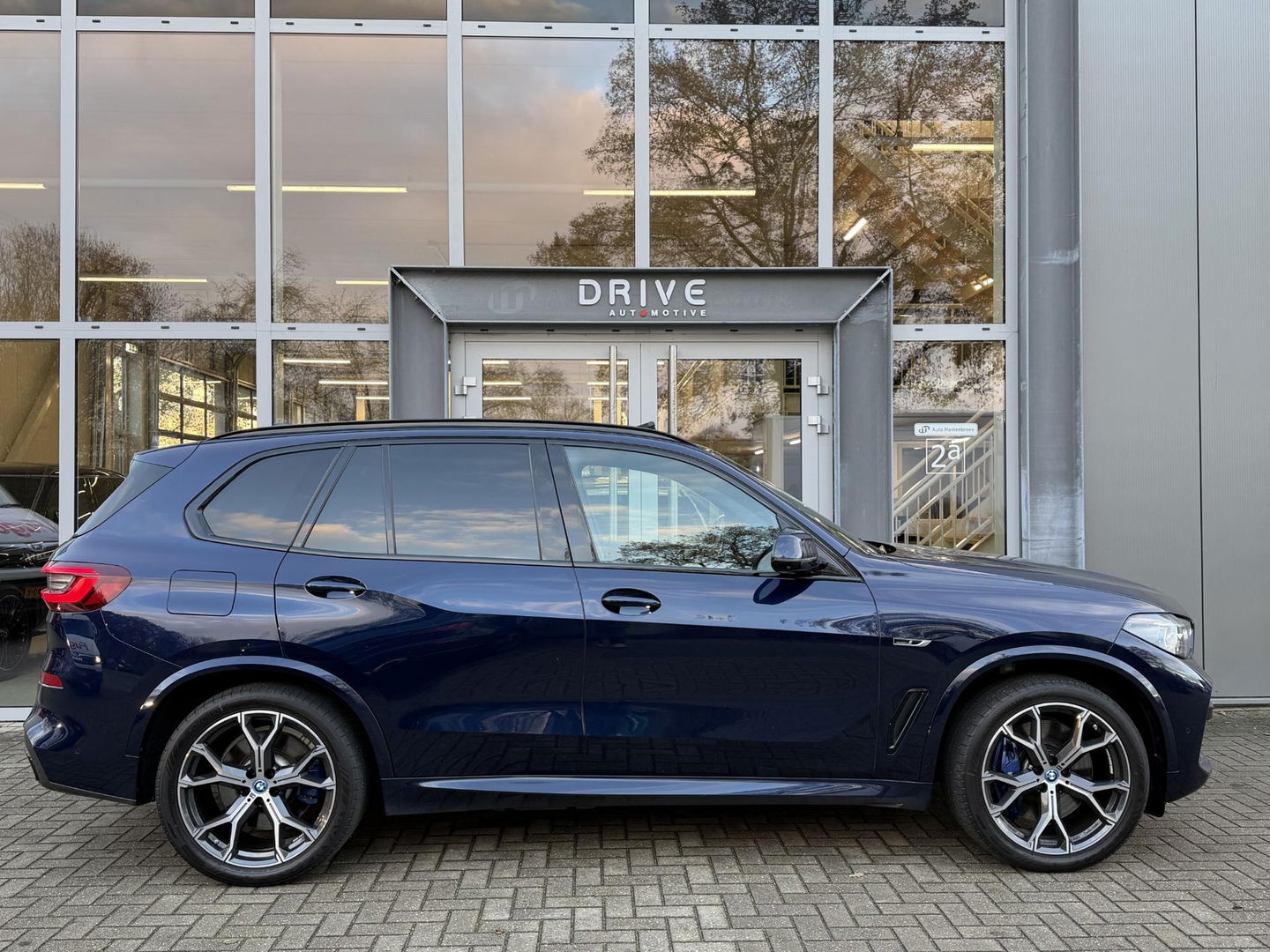 BMW X5 xDrive45e High Ex. M-Sport|Individual|SOH93%|Pano|Laser|CoPilot|21"|HUD|HIFI|Trekhaak|Tansanit