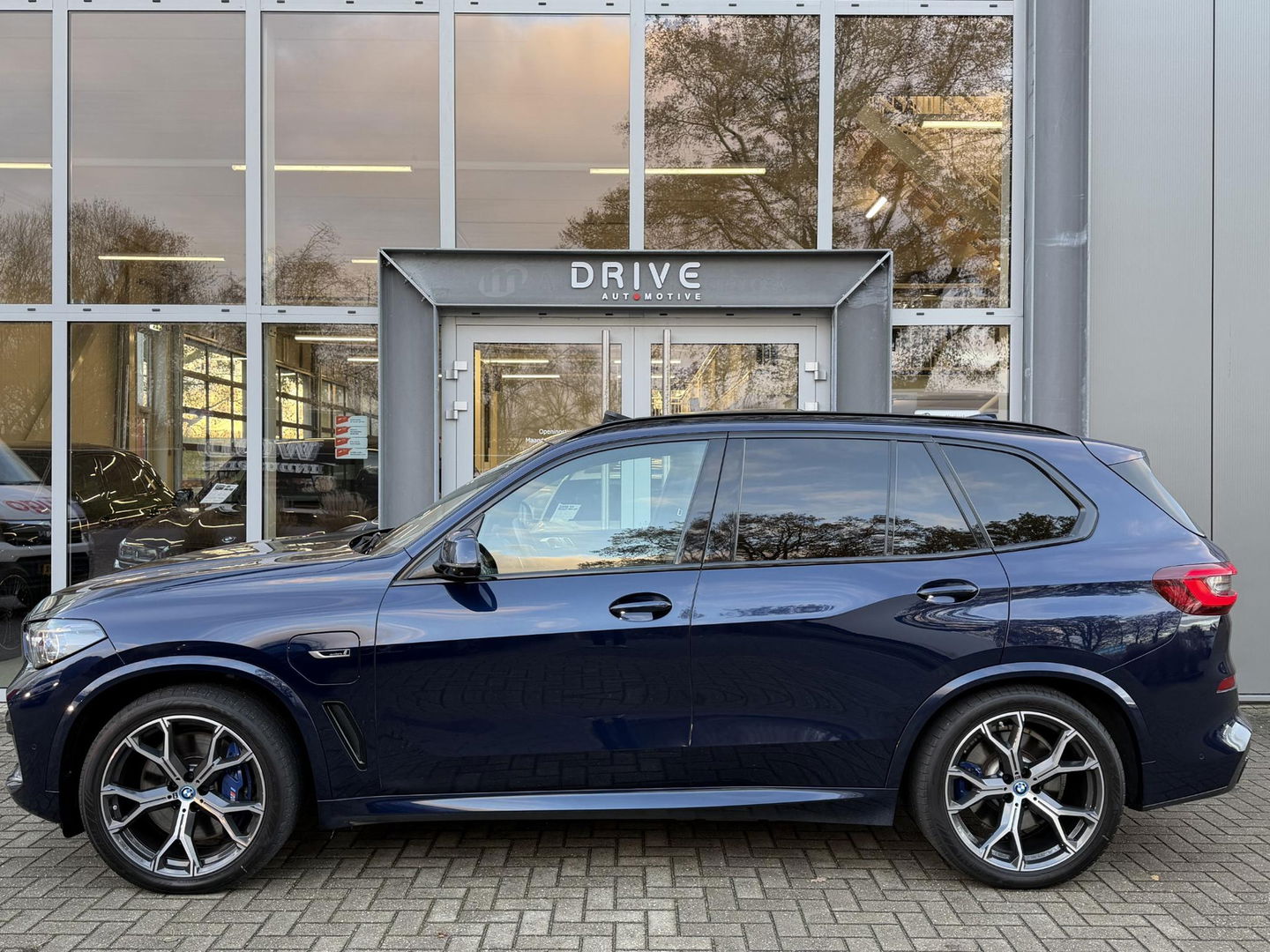 BMW X5 xDrive45e High Ex. M-Sport|Individual|SOH93%|Pano|Laser|CoPilot|21"|HUD|HIFI|Trekhaak|Tansanit