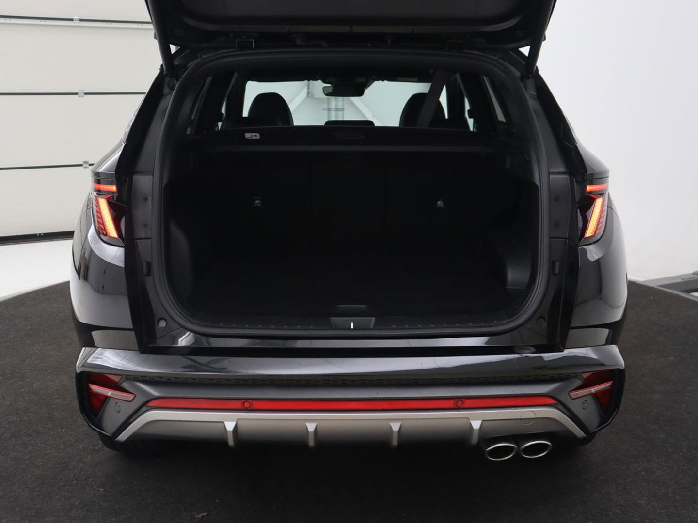 Hyundai Tucson 1.6 T-GDI PHEV N Line Sky 4WD | Panoramadak | Leder/Alcantara | Stoelverwarming | Camera | Carplay | Stuurverwarming | Keyless | Full LED | Navigatie | 19'' lichtmetalen velgen | Plug In