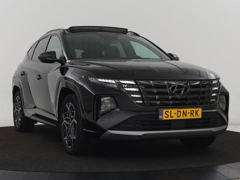 Hyundai Tucson 1.6 T-GDI PHEV N Line Sky 4WD | Panoramadak | Stoelverwarming | Leder/Alcantara | Camera | Adaptive cruise | Carplay | Full LED | Stuurverwarming | Keyless | Plug In
