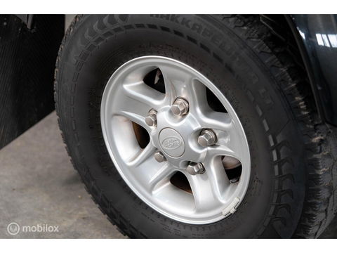 Land Rover Defender 90 SW geel kenteken