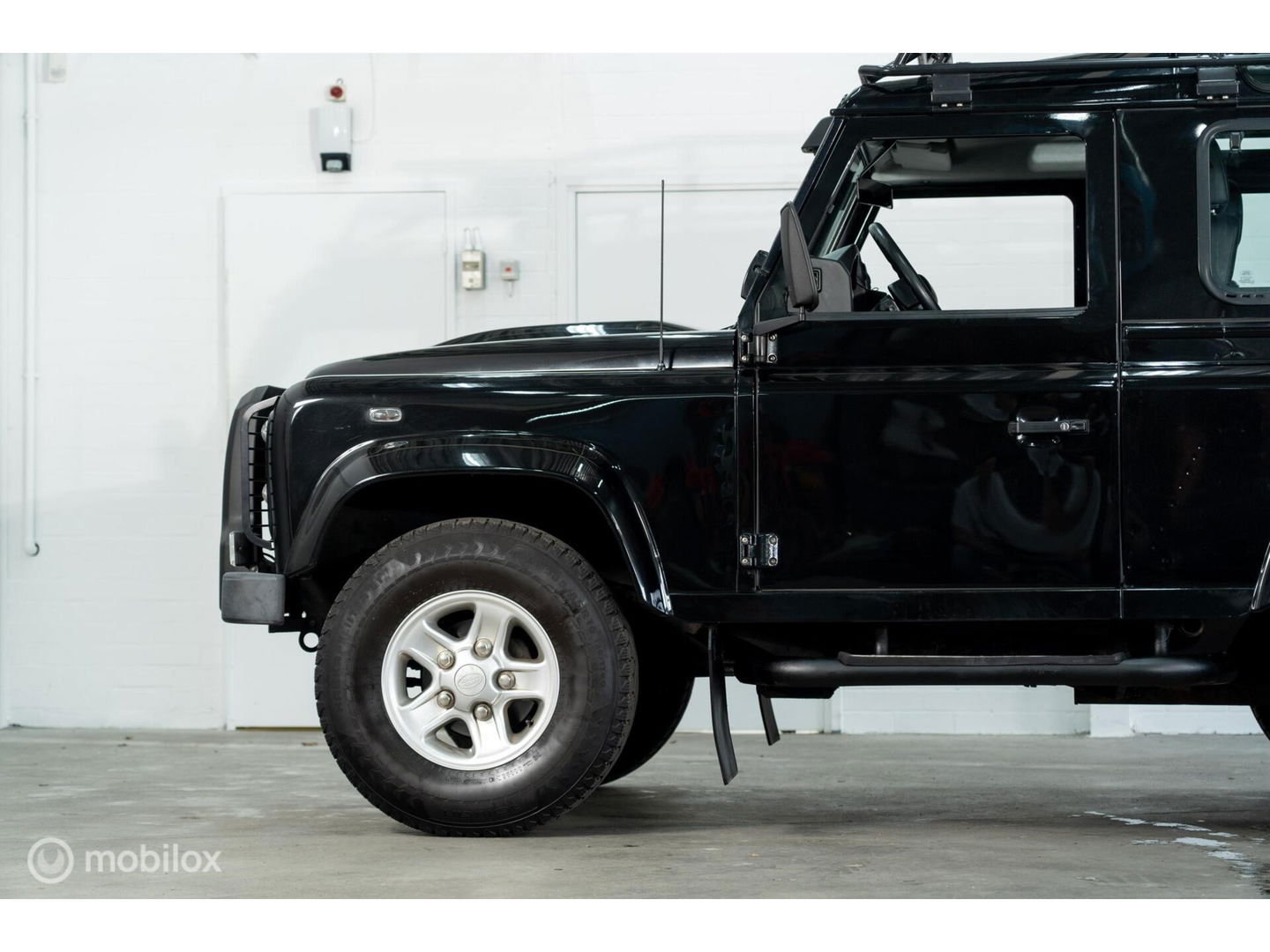 Land Rover Defender 90 SW geel kenteken
