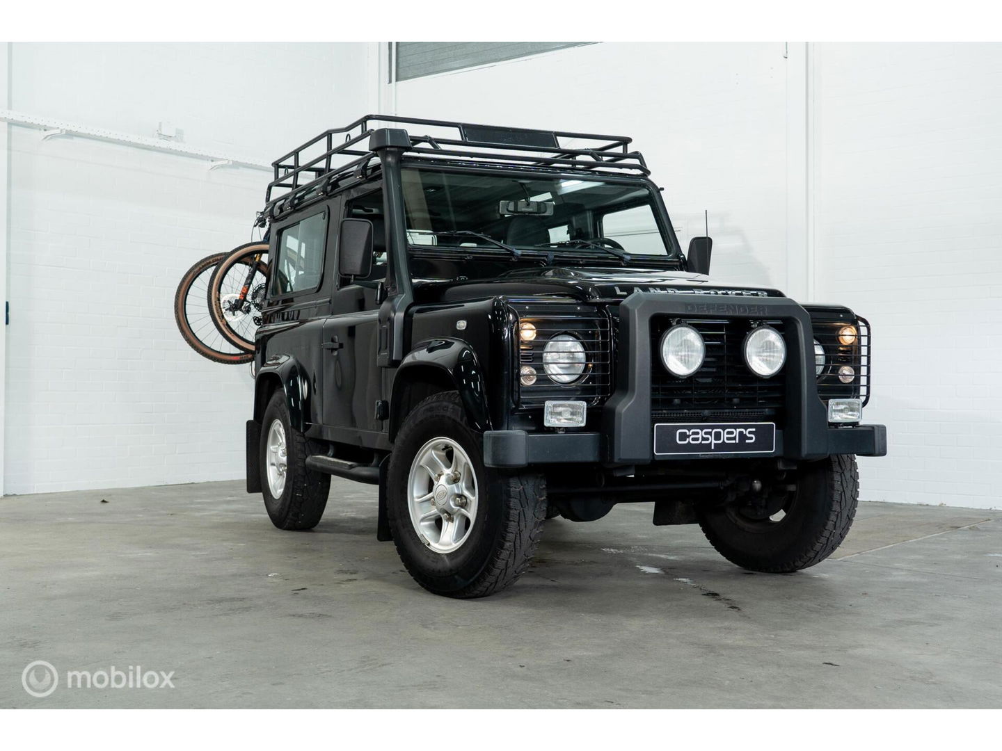 Land Rover Defender 90 SW geel kenteken