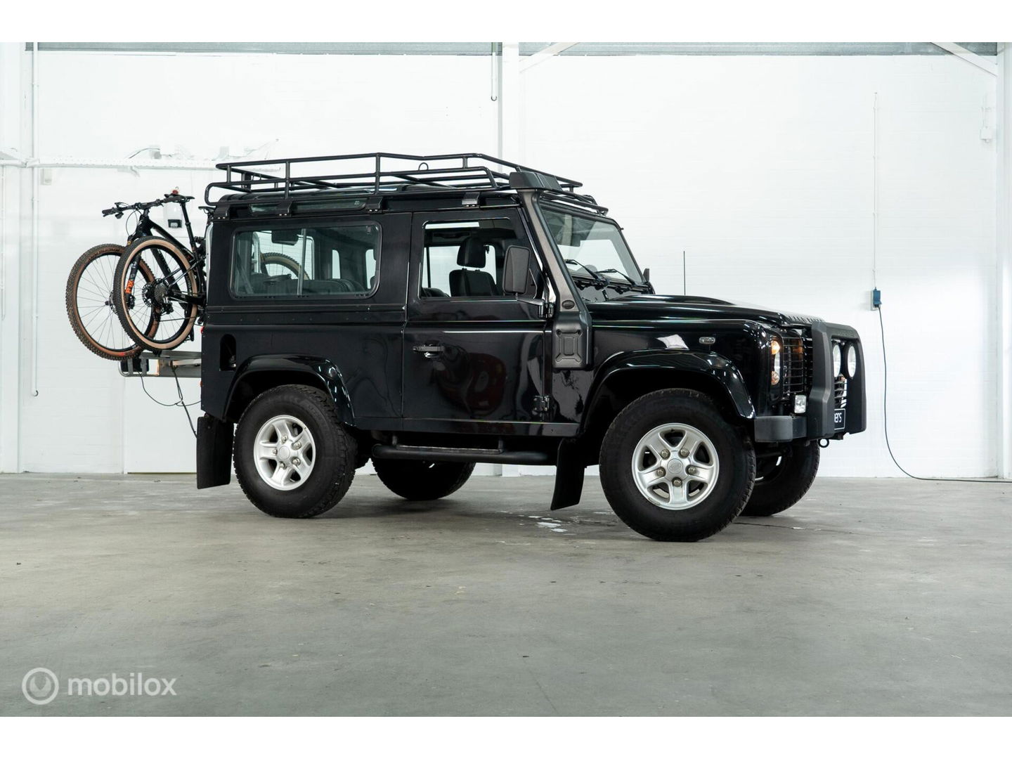 Land Rover Defender 90 SW geel kenteken