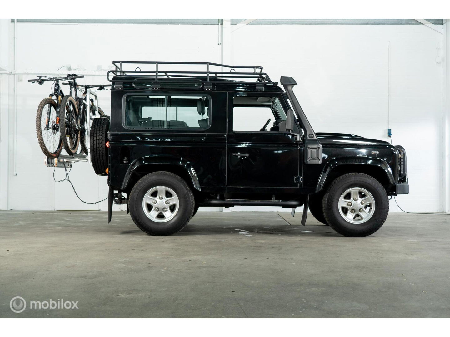 Land Rover Defender 90 SW geel kenteken