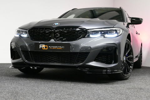 BMW 3 Serie Touring 330e xDrive M Sport / M340i Diffuser / Black Diamond M Grill / M340i M Sport bumper pakket / Schuif-/kanteldak / Elektr. verstelbare voorstoelen (links met memory) / Stoelverwarming / Apple Carplay - Android Auto / Achteruitrijcamera / Trekhaak (z