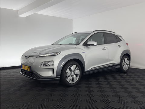 Hyundai KONA EV Fashion 64 kWh (3-Fase) {SOH-100%} (INCL-BTW)  Aut * HEATPUMP | NAVI-FULLMAP | LEATHER-FABRIC | KEYLESS | CAMERA | DAB | ECC | PDC | ADAPTIVE-CRUISE | LANE-ASSIST | HEATED SEATS | PRIVACY-GLASS | HEAD-UP | SHIFT-PADDLES | 17"A