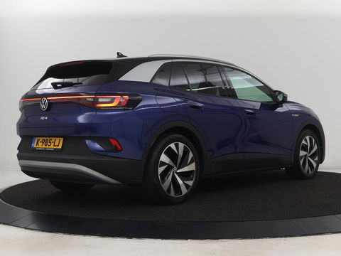 Volkswagen ID.4 First 77 kWh | Stoel & stuurverwarming | Camera | Carplay | Adaptive cruise | Half leder | 20'' | Navigatie | DAB | Sfeerverlichting