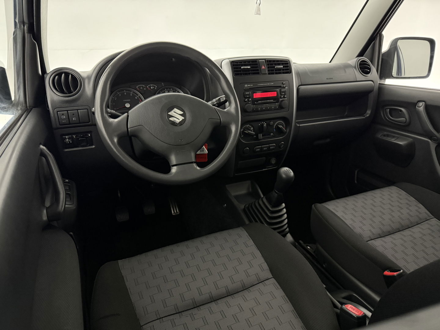 Suzuki Jimny 1.3 Exclusive | 4x4 | Airco | Bullbar | Sidebars | 15"LMV | Elektrpakket