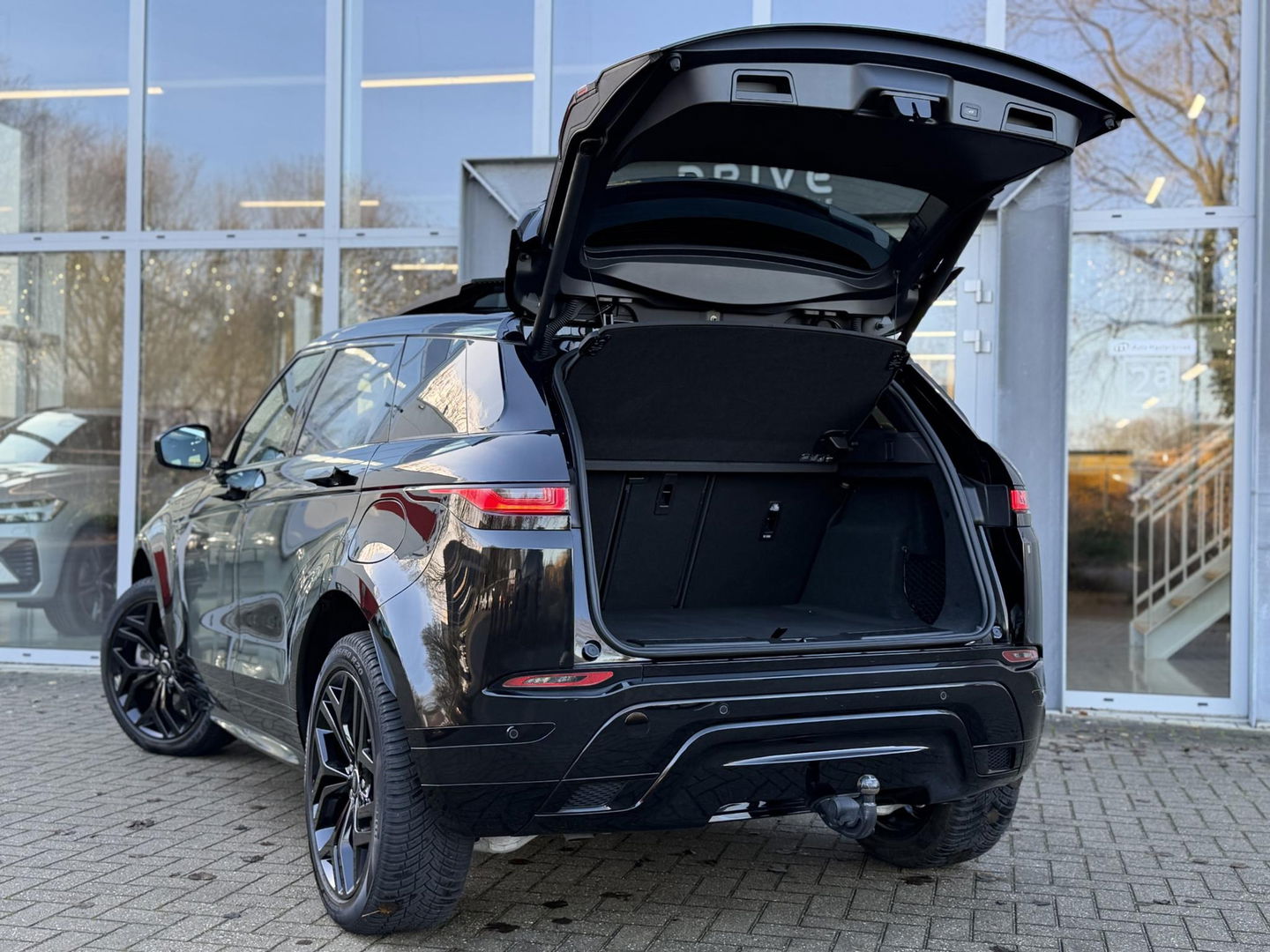 Land Rover Range Rover Evoque 1.5 P300e AWD R-Dynamic SE Black Style|Schuif/Kantel dak|Sfeer|Meridian|Memory|ACC|Winterpakket|Trekhaak