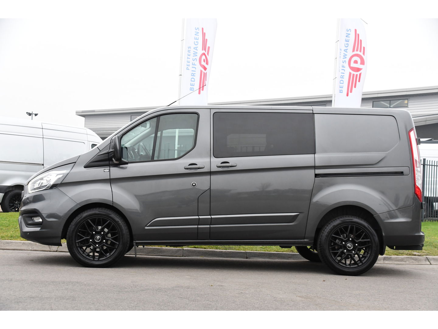 Ford Transit Custom 300 2.0 TDCI L1H1 Limited DC Raptor Edition Camera, Cruise, Carplay, 2 x Schuifdeur, LED, Stoelverwarming, 130pk, Automaat, Uniek!