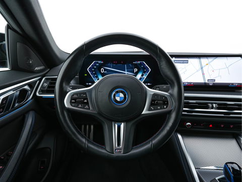 BMW i4 M50 M-Sportpack High Executive 84 kWh [ 3-Fase ] {SOH-97%} (INCL-BTW) *HEAD-UP | LASER-LED | LUXURY-LEATHER | HARMAN/KARDON | ADAPTIVE-CRUISE | BLIND-SPOT | TOP-VIEW | HEATED-SPORTSEATS | DAB+ | WIDE-COCKPIT | AMBIENT-LIGHT | NAVI-FULLMAP | 19