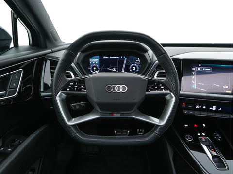 Audi Q4 e-tron 40 S-Line Competition Launch edition 77 kWh [ 3-Fase ] {SOH-87%} (INCL-BTW) *HEAT-PUMP | PANO | LEATHER-FABRIC | MATRIX-LED | ADAPTIVE-CRUISE | HEATED-SPORTSEATS | AMBIENT-LIGHT | DIGI-COCKPIT | CAMERA | KEYLESS | NAVI-FULLMAP | ...