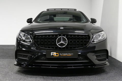 Mercedes-Benz E-Klasse 300 e AMG Line / E63s AMG Diffuser / Panamericana Grille / Panoramadak / Elektr. verstelbare voorstoelen + memory / Burmester Surround Sound / Ambienteverlichting / Apple Carplay - Android Auto / Maxton Design Frontlip / Rondomzichtcamera / Stoelverwarmin