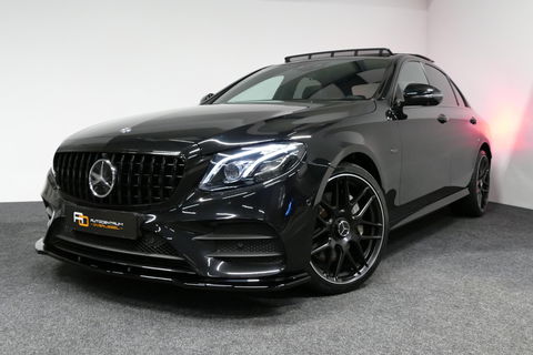 Mercedes-Benz E-Klasse 300 e AMG Line / E63s AMG Diffuser / Panamericana Grille / Panoramadak / Elektr. verstelbare voorstoelen + memory / Burmester Surround Sound / Ambienteverlichting / Apple Carplay - Android Auto / Maxton Design Frontlip / Rondomzichtcamera / Stoelverwarmin