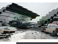 Porsche Cayenne Coupé - 3.0 E-Hybrid 462PK Krijtgrijs SportDesign Luchtvering Lightweight Package Carbon Dak 4-wielsturing NLauto