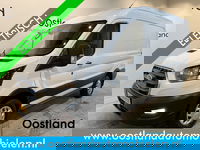 Ford E-Transit - 350 L2H2 Trend 68 kWh / 100% Elektrisch !! / Airco / Cruise Control / CarPlay / Camera / Navigatie / 3-Zits / 11.500 KM !!