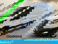 Ford E-Transit - 350 L2H2 Trend 68 kWh / 100% Elektrisch !! / Airco / Cruise Control / CarPlay / Camera / Navigatie / 3-Zits / 10.000 KM !!