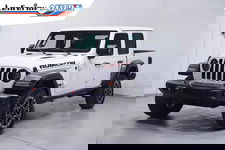 Jeep Gladiator - 3.6 V6 285 pk Rubicon Grijs Kenteken 2-Zits Navi Leder Zwart, Adapt. Cruise, Targa Dak, Trekhaak, Uniek