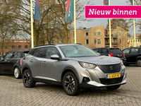 Peugeot e-2008 - Allure Pack 50 kWh - Carplay, Digitaal Cockpit, Half Leer, Navi, Cruise, Camera, Stoelverw. Afn. Trekhaak