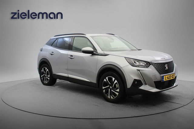 Peugeot e-2008 - Allure Pack 50 kWh - Carplay, Digitaal Cockpit, Half Leer, Navi, Cruise, Camera, Stoelverw. Afn. Trekhaak