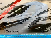 Ford E-Transit - 350 L2H2 Trend 68 kWh / 100% Elektrisch !! / Airco / Cruise Control / CarPlay / Camera / Navigatie / 3-Zits / 6.500 KM !!