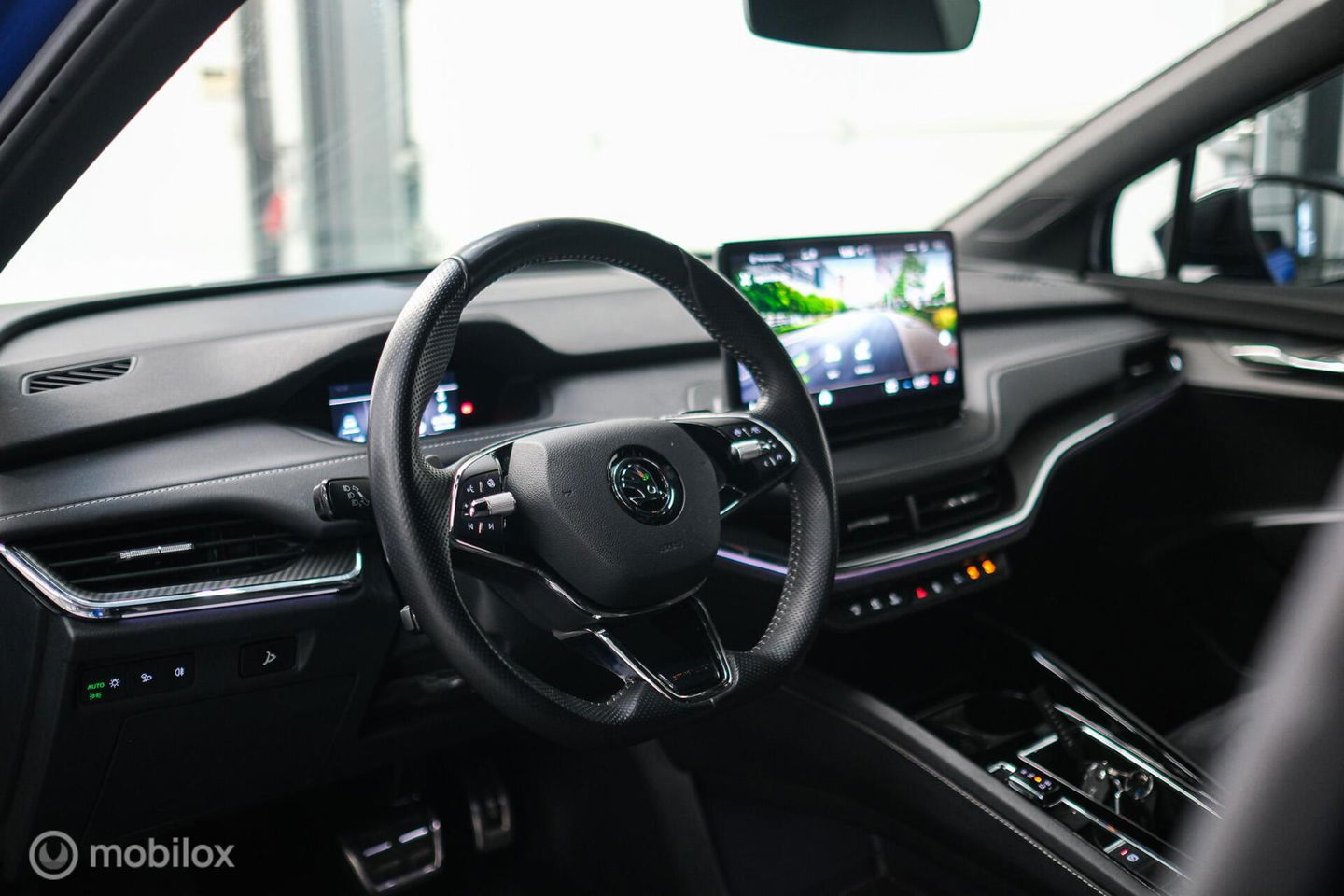 Škoda Enyaq iV 60 Sportline | Sportstoelen | Alcantara | Camera | NL auto | 1e eigenaar | Energy Blue | LED | Rijklaarprijs |