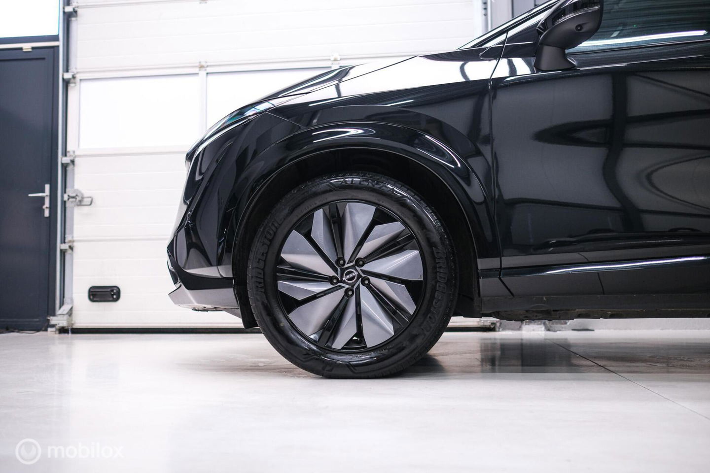 Nissan ARIYA Advance 66 kWh | 360 camera | navigatie | Halfleder | NAP NL auto | Rijklaarprijs | stoelverwarming |