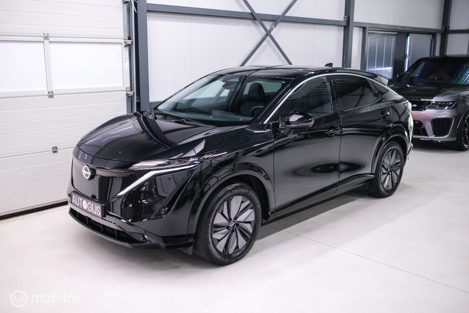 Nissan ARIYA Advance 66 kWh | 360 camera | navigatie | Halfleder | NAP NL auto | Rijklaarprijs | stoelverwarming |