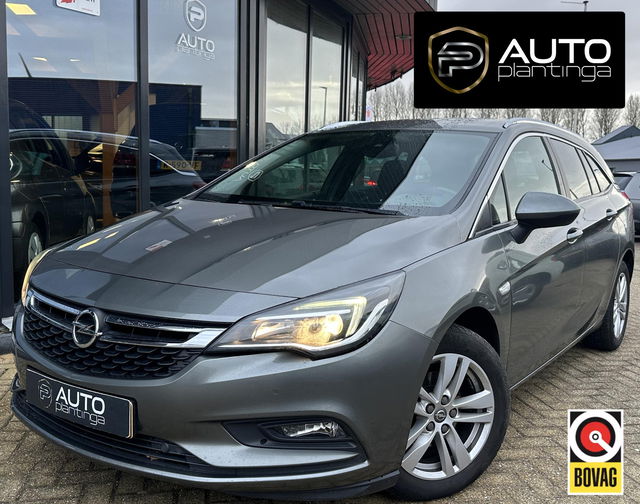 Opel Astra - Sports Tourer 1.4 Turbo 120 Jaar Edition 150PK | AUTOMAAT | ZEER NETTE STAAT | Trekhaak | Stoel en Stuur Verwarming | APK tot 29-04-2027 |