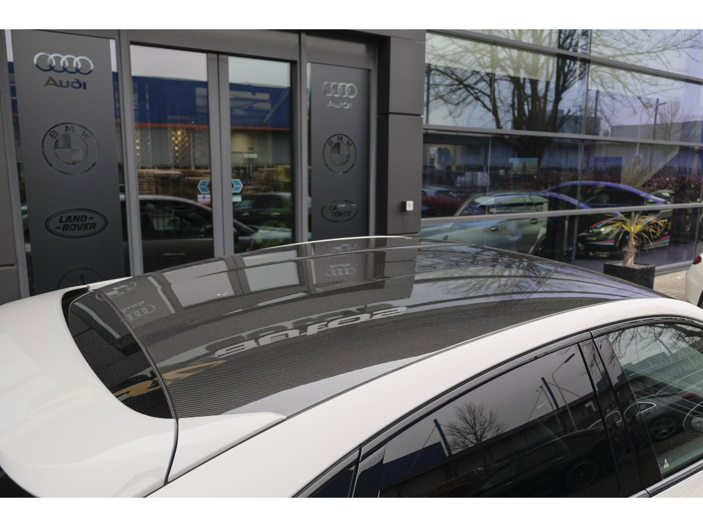 Porsche Cayenne Coupé 3.0 E-Hybrid 462PK Krijtgrijs SportDesign Luchtvering *SOH 82%* Lightweight Package Carbon Dak 4-wielsturing NLauto