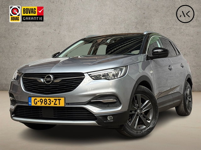 Opel Grandland X - 1.2 Turbo 120 Jaar Edition Automaat (APPLE CARPLAY, GROOT NAVI, CLIMATE, LEDER, CAMERA, SPORTSTOELEN, GETINT GLAS, CRUISE, NIEUWSTAAT)