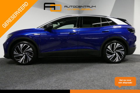 Volkswagen ID.4 First Max 77 kWh / SOH 92% / Panoramadak / Matrix LED IQ.Light / Elektr. verstelbare voorstoelen + memory / HUD Augmented Reality / Rondomzichtcamera / Apple Carplay - Android Auto / Stoelverwarming / 21'' LMV / Keyless / Achteruitrijcamera / Navigatie / 