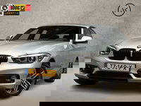 BMW 1 Serie - 118i Sport Line Automaat (VIRTUAL COCKPIT, NAVIGATIE, ZWART HEMEL, CLIMATE, PARKEERSENSOREN, SPORTSTOELEN, CRUISE, NIEUWE APK, NIEUWSTAAT)