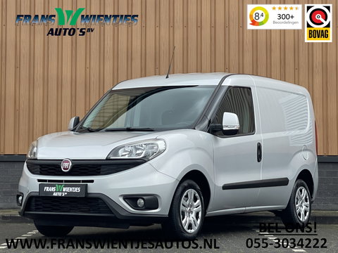 Fiat Doblò 1.3 MJ L1 | Marge! | Trekhaak | Navigatie | Airconditioning | Cruise Control | Bluetooth | DAB | Multifunctioneel Stuurwiel | Elektrische Spiegels | Elektrische Ramen |