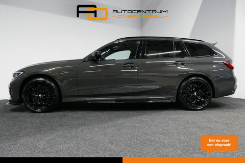 BMW 3 Serie Touring 330e xDrive M Sport / M340i Diffuser /  Black Diamond M grille / M340i M Sport bumper pakket / BMW Laser Light / Panoramadak / Premium kleur Dravitgrau / Elektr. verstelbare voorstoelen links met memory / Apple Carplay - Android Auto / Stoelverwar