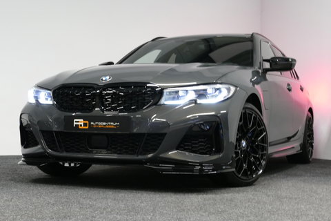 BMW 3 Serie Touring 330e xDrive M Sport / M340i Diffuser /  Black Diamond M grille / M340i M Sport bumper pakket / BMW Laser Light / Panoramadak / Premium kleur Dravitgrau / Elektr. verstelbare voorstoelen links met memory / Apple Carplay - Android Auto / Stoelverwar
