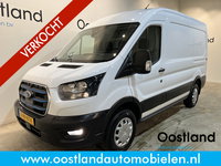Ford E-Transit - 390 (3500 kg) L2H2 Trend 68 kWh / 100% Elektrisch !! / Airco / Cruise Control / CarPlay / Camera / Navigatie / 3-Zits / 10.400 KM !!