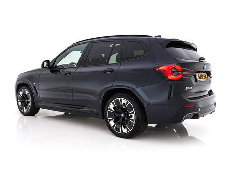 BMW iX3 High Executive 80 kWh Facelift [ 3-Fase-11kW) ] {SOH-100%} (INCL-BTW) Aut. *PANO | LEATHER | ADAPTIVE-CRUISE | FULL-LED | HARMAN/KARDON | TOPVIEW | MEMORY-PACK | BLINDSPOT | DIGI-COCKPIT | HEATED-COMFORTSEATS | DAB+ | NAVI-FULLMAP | HEAD-UP | 20''ALU