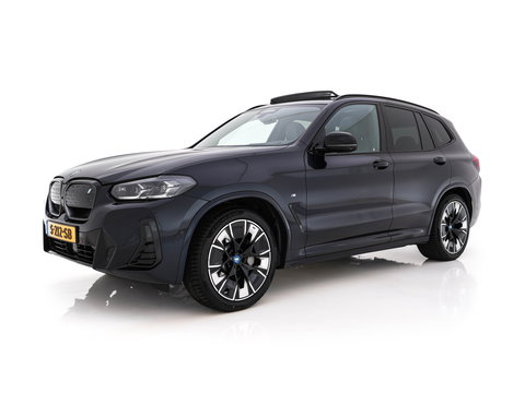BMW iX3 High Executive 80 kWh Facelift [ 3-Fase-11kW) ] {SOH-100%} (INCL-BTW) Aut. *PANO | LEATHER | ADAPTIVE-CRUISE | FULL-LED | HARMAN/KARDON | TOPVIEW | MEMORY-PACK | BLINDSPOT | DIGI-COCKPIT | HEATED-COMFORTSEATS | DAB+ | NAVI-FULLMAP | HEAD-UP | 20''ALU