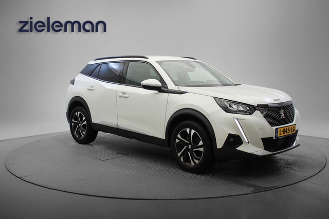 Peugeot 2008 - 1.2 PureTech Allure Pack Automaat - Carplay, Camera, half Leer, Keyless, Stoelverw.