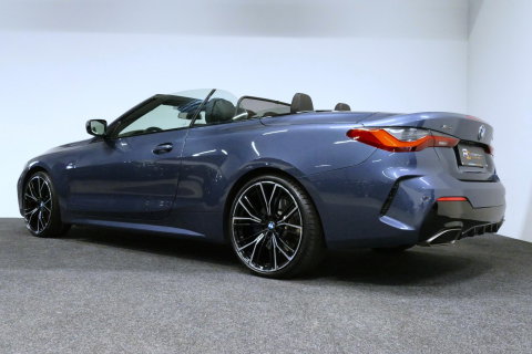 BMW 4 Serie Cabrio M440i xDrive High Executive / Air Collar (nekverwarming / BMW Laserlight / Elektr. verstelbare voorstoelen (links met memory) / Harman Kardon Surround Sound / Stoelverwarming / 20" / Rondomzichtcamera / HUD / Apple Carplay - Android Auto / Adaptief