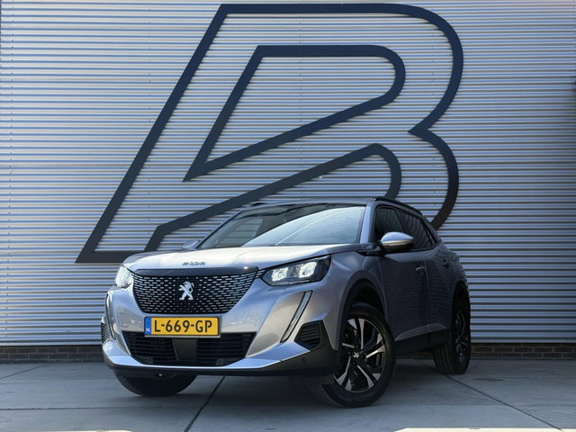 Peugeot 2008 - 1.2 PureTech Blue Lease Allure 2e Eigenaar|Navi|Camera|D-riem v.v. in 2026|Clima|Cruise|Carplay|APK tot 02-2028