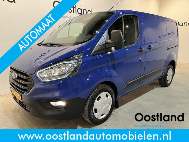 Ford Transit Custom - 280 2.0 TDCI L1H1 Trend 130 PK Automaat / Euro 6 / Schuifdeur L + R / Airco / CarPlay / Cruise Control Adap. / Trekhaak / Navigatie / 3-Zits