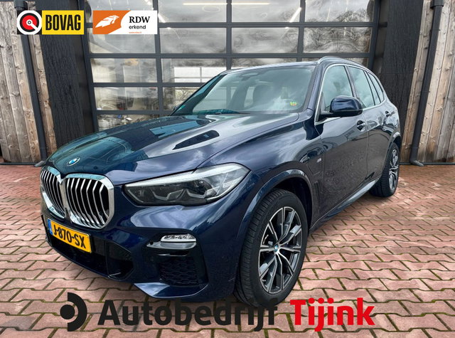 BMW X5 - xDrive45e High Executive M-Sport | Luchtvering |  Elek. trekhaak | Safety pack | Achterasbesturing | HUD | M aerodynamica | Leder |