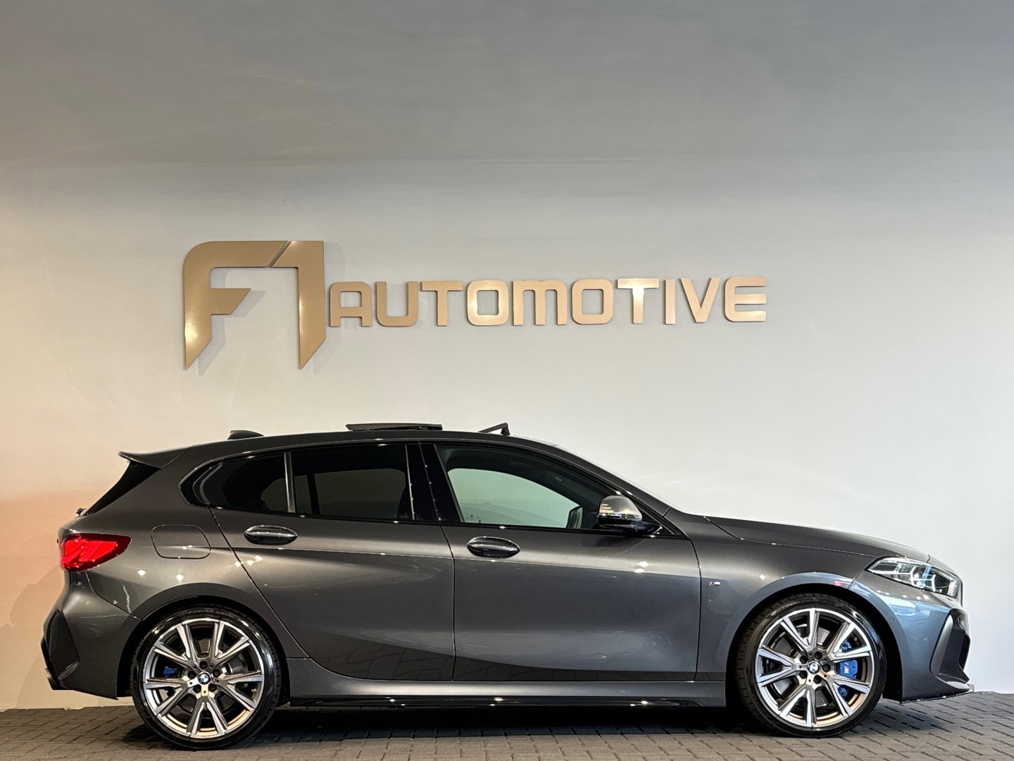 BMW 1-serie M135i xDrive High Executive Edition Pano|HuD|H/K
