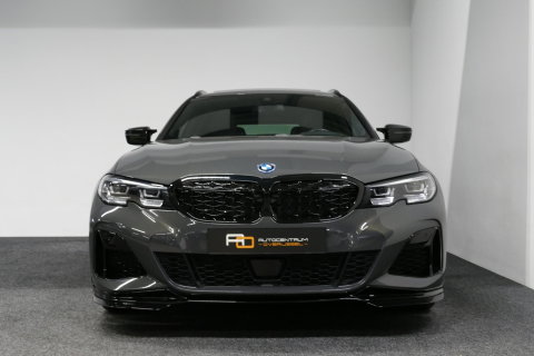 BMW 3 Serie Touring 320e xDrive M Sport / M340i Diffuser / Black Diamond M Grille / M340i M Sport bumper pakket / Schuif-/kanteldak / Elektr. verstelbare voorstoelen (links met memory) / Stoelverwarming / Apple Carplay - Android Auto / Achteruitrijcamera / Ambienteve