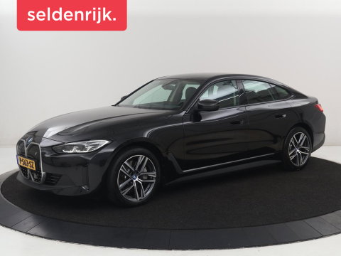 BMW i4 eDrive40 84 kWh | SOH 93,8% | Camera | Adaptive cruise | Climate control | Navigatie | DAB+ | Bluetooth | Stoelverwarming | Carplay